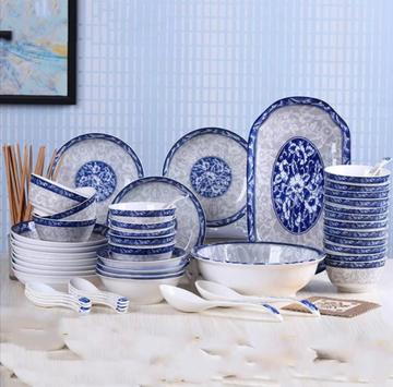 52-piece Ceramic Bluish Dinner Set displayed on a table with blue and white color, showcasing all plates, bowls, and serving utensils.