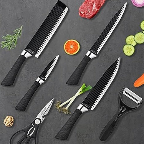 6 pcs black knife set arranged on a sleek black tabletop, showcasing its elegant design.