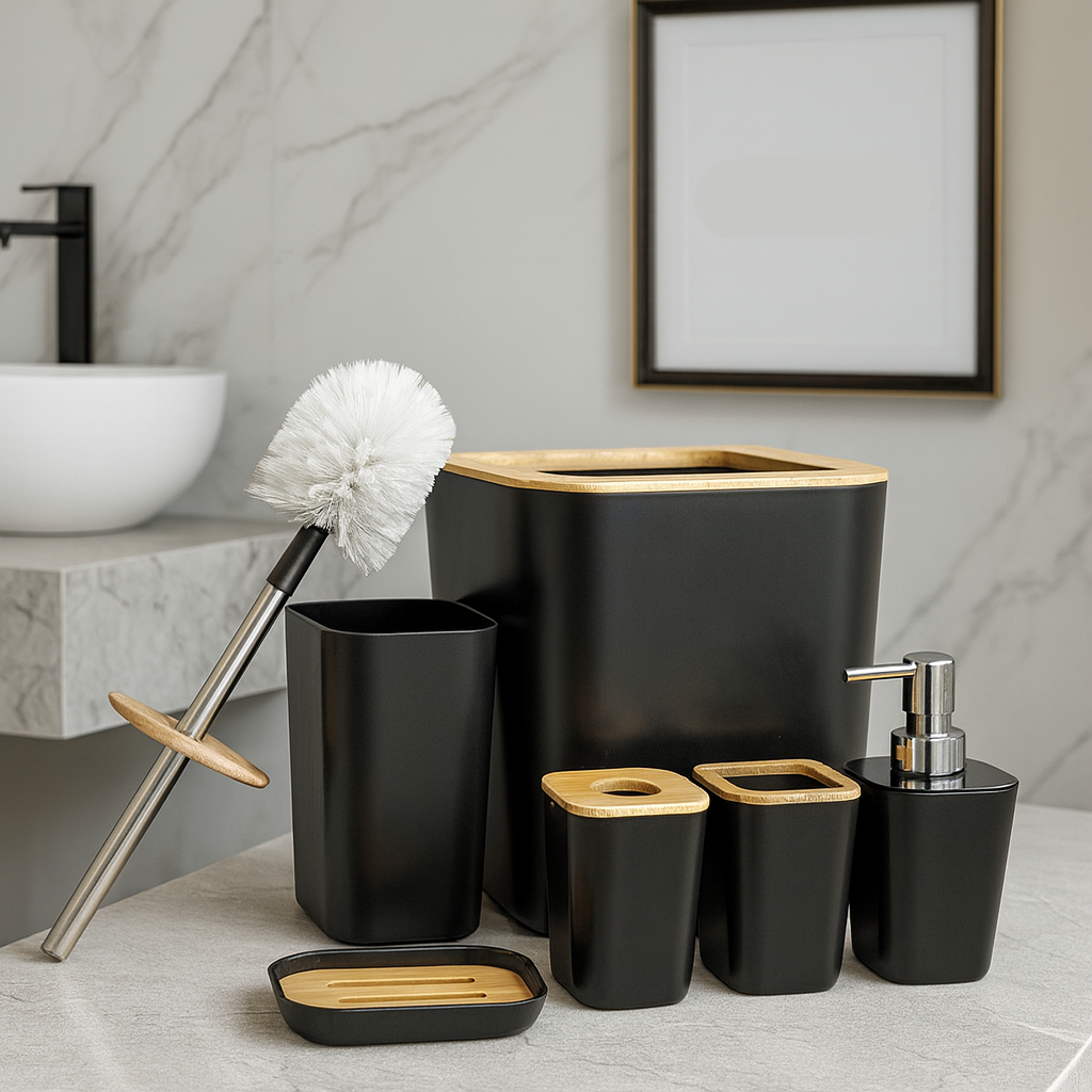 Bathroom accessories including a black trash can, soap dispenser, and other items on a marble surface.