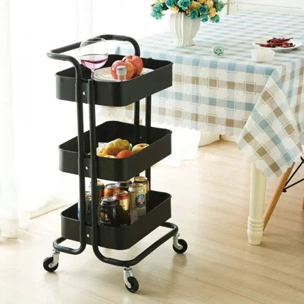 Black 3 Tier Kitchen Trolley Rack showcasing sturdy metal frame, ABS shelves, and spacious storage with decorative plants on the middle shelf.