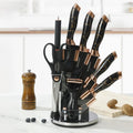  Black textured handle knife set with rose gold accents, all pieces displayed in the acrylic rotating stand.