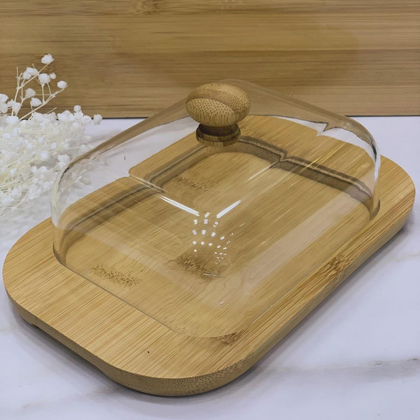  Butter Plate featuring a clear lid and bamboo base, showcasing its sleek design for serving butter, cheese, or small appetizers.