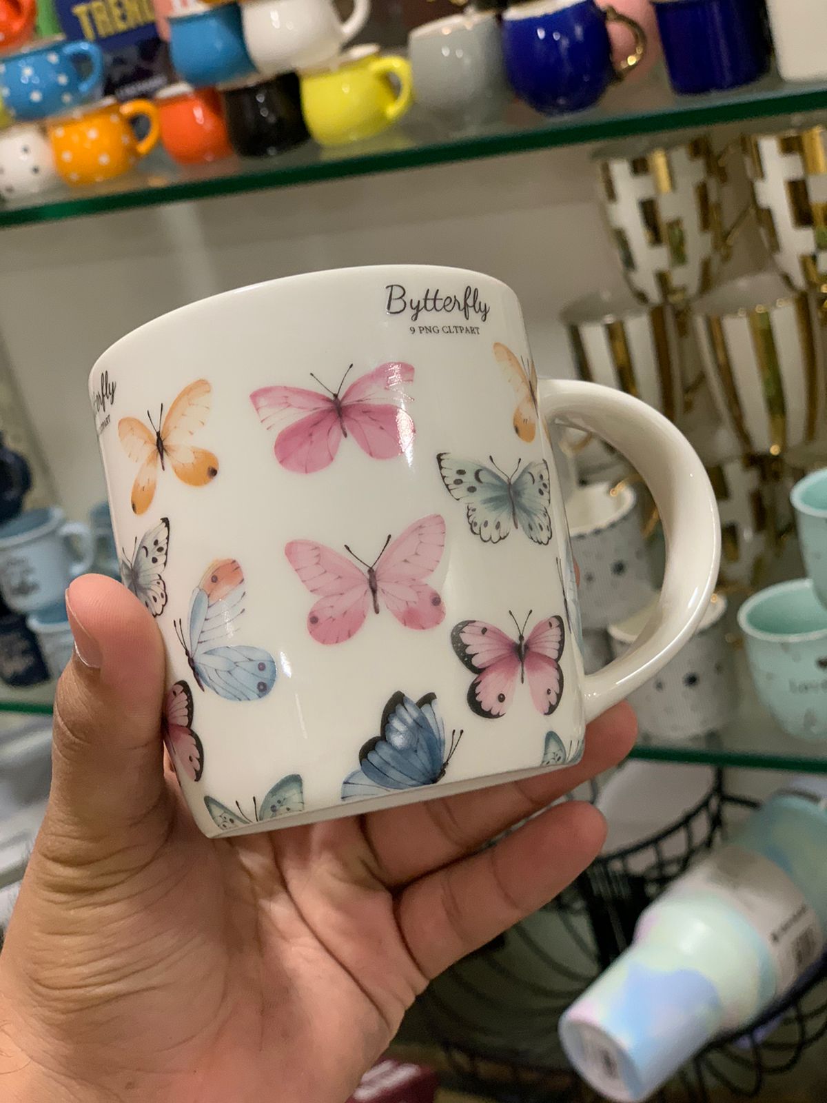 Close-up of Danny Home™ mug with butterfly design.