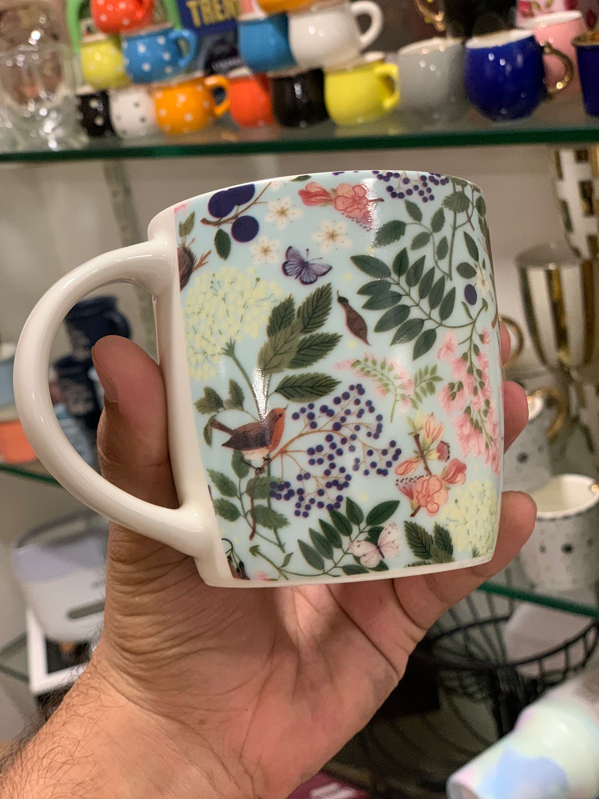 Close-up of Danny Home™ mug with vibrant floral design.