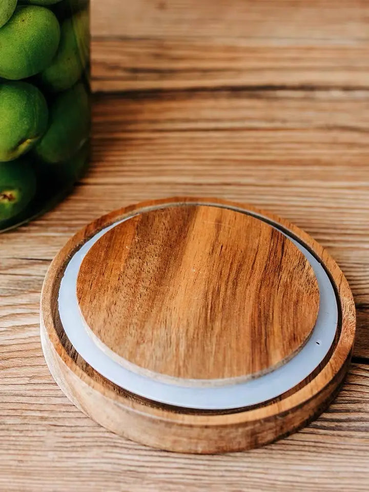 Close-up of airtight bamboo lid with rubber seal for secure, moisture-proof storage of pantry essentials like coffee, tea, and sugar.