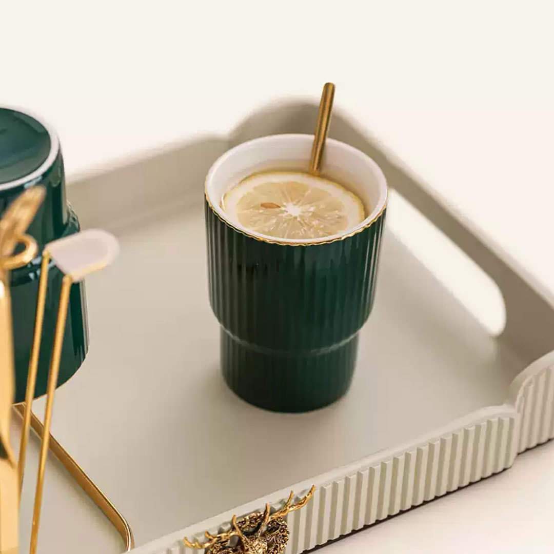 Close-up of the cup placed on the tray, showcasing its smooth ceramic finish and elegant design.