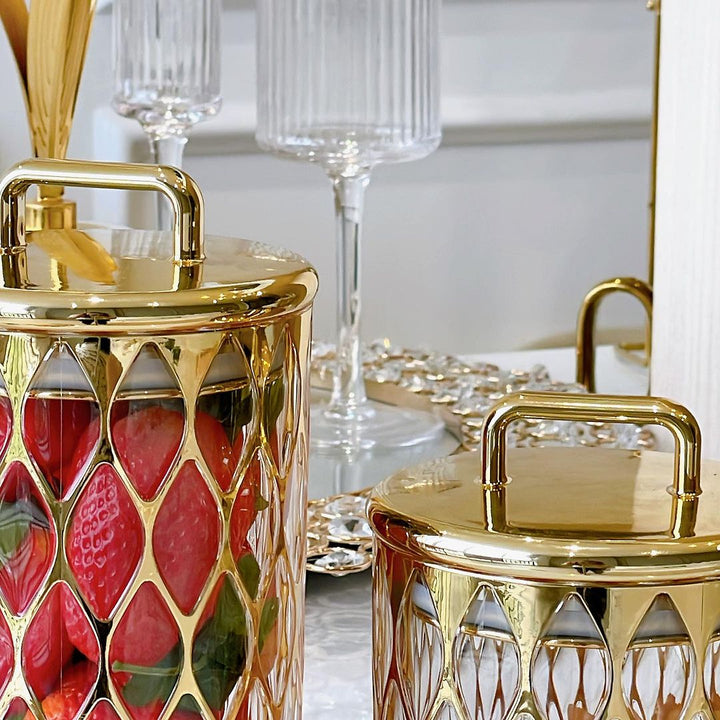 Close-up of the gold lids of the Acrylic Airtight Cookie Canisters.