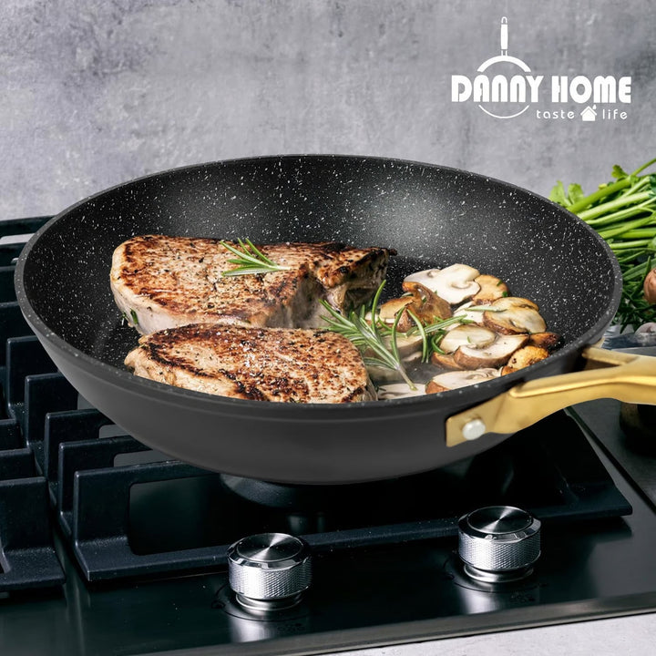 Different angle of Danny Home™ Aluminum Frying Pan Black on stove with steaks cooking. Showcasing even heat distribution for perfect cooking results.