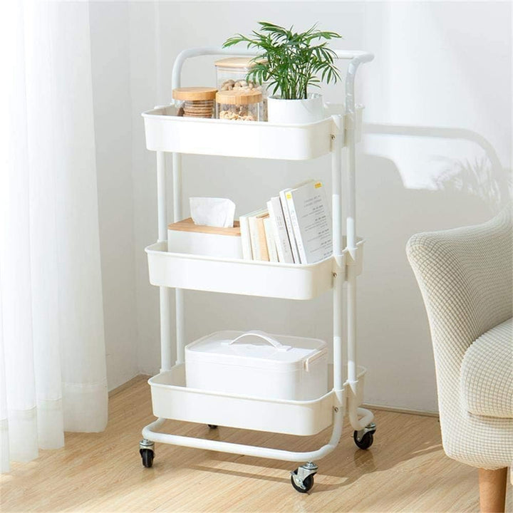 Different angle of white 3 Tier Kitchen Trolley Rack with durable metal frame and ABS shelves, featuring decorative plants on the middle shelf.