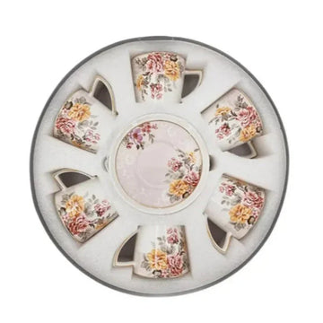 Elegant floral white ceramic cup and saucer set displayed in open box packaging, showcasing six pieces with a timeless and sophisticated design.