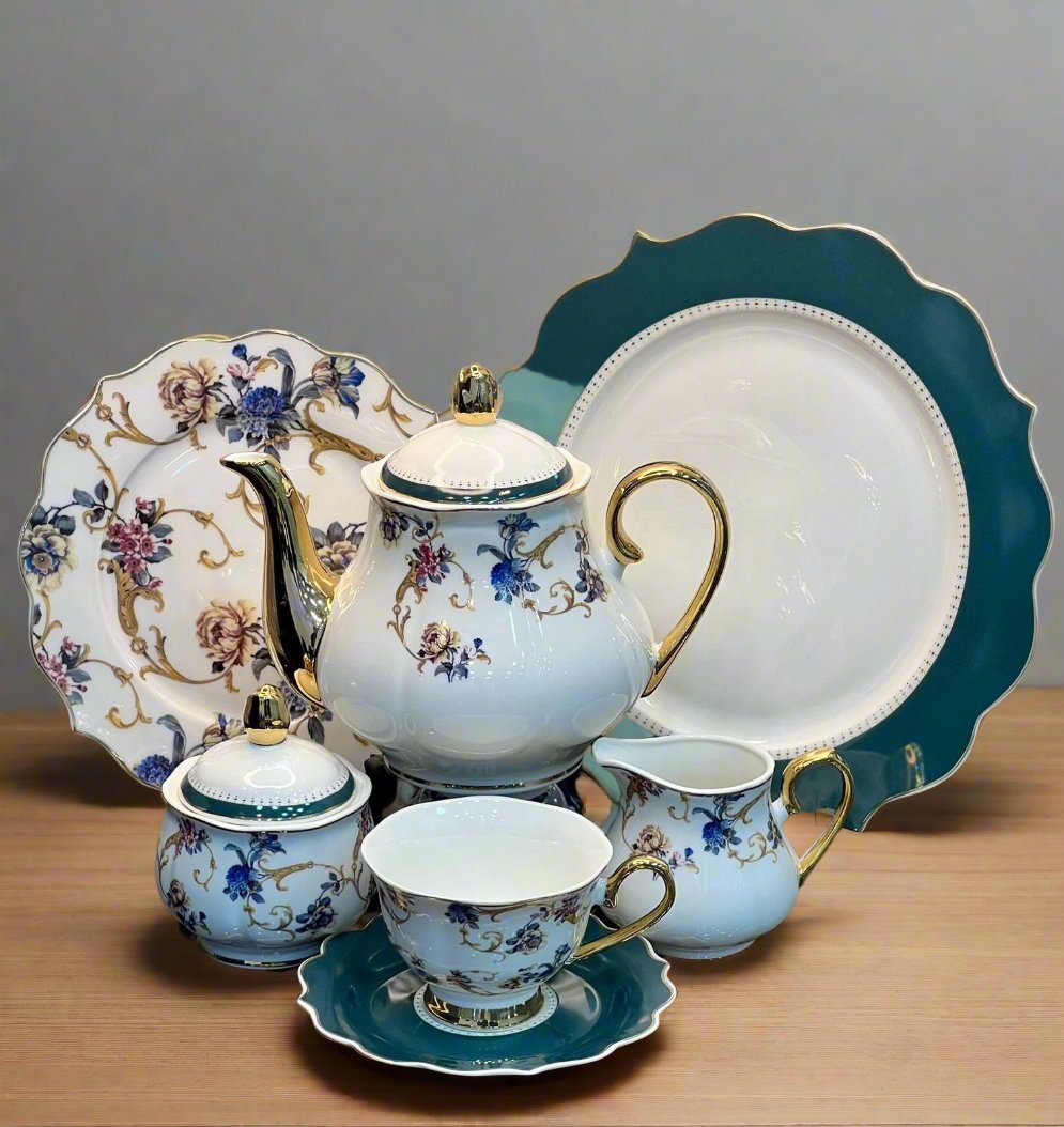 Elegant green floral bone china tea set with tea pot, cups, saucers, plates, and sugar pot. Perfect for hosting tea parties. Available at HaulJunction.