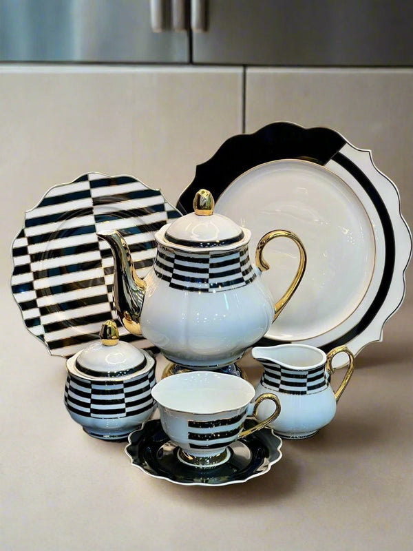 Elegant white and black patterned tea set with teapot, tea cups, plates, and saucers from HaulJunction. Perfect for tea time, featuring fine bone china craftsmanship