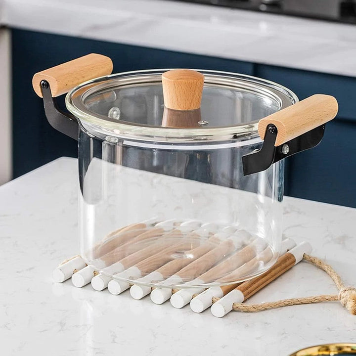 Empty glass cooking pot showcasing its transparent design and sturdy build.