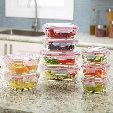 Four sizes of HaulJunction Air Tight Glass Food Containers, each with two containers filled with fresh fruits and vegetables, sealed with airtight lids for optimal freshness.