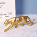 Leopard ornament displayed on a white marble tabletop, highlighting its elegant and modern design.