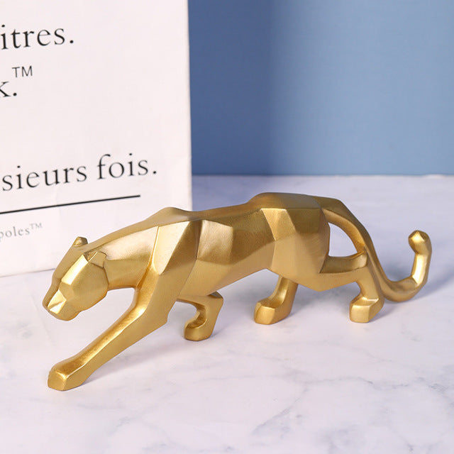 Leopard ornament displayed on a white marble tabletop, highlighting its elegant and modern design.