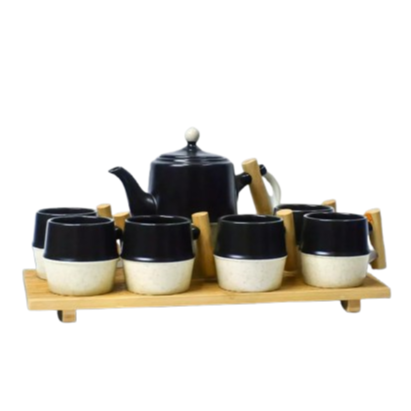 Luxury Subaishi tea set featuring a black and white porcelain teapot with matching cups, elegantly arranged on a wooden tray—perfect for serving tea in style.