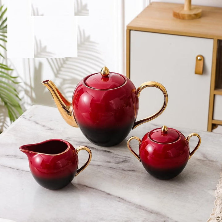 Premium Tea Set – Close-Up of Teapot, Creamer, and Sugar Bowl with Gold Accents in Red & Black