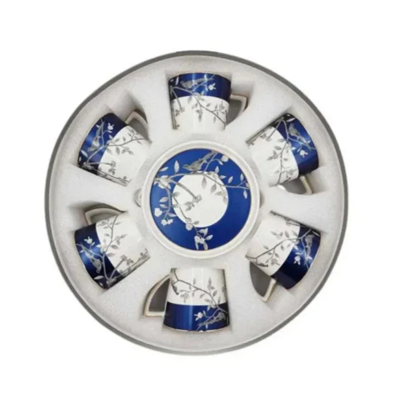 Showcasing a ceramic Cup & Saucer Set with a charming bird design in an open box packaging.