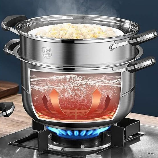 Steamer pot on gas stove with animated heat rising, cooking dumplings on top.