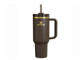 A brown Stanley Quencher Tumbler with a handle and a straw spout, featuring a gold accent on the lid.