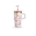 A white tumbler with a floral pattern, a pink lid, and a decorative element on the lid. 20oz