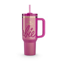 A pink Stanley Quencher Tumbler 40oz with the name 'Barbie' printed on it, featuring a straw and a handle.