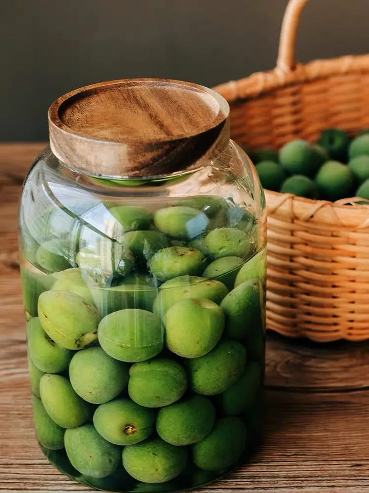 Various angles of 3000ml glass jar filled with olives and water, showcasing its elegant design and functionality for pantry organization