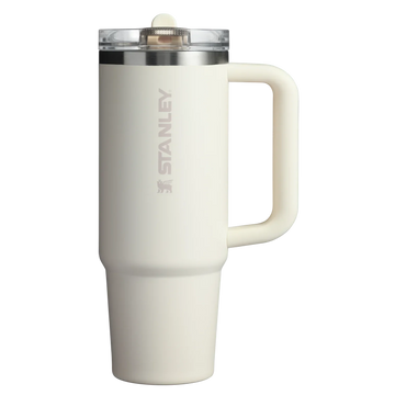 A white Stanley Quencher ProTour Flip Straw Tumbler with a handle and a clear screw-on lid.