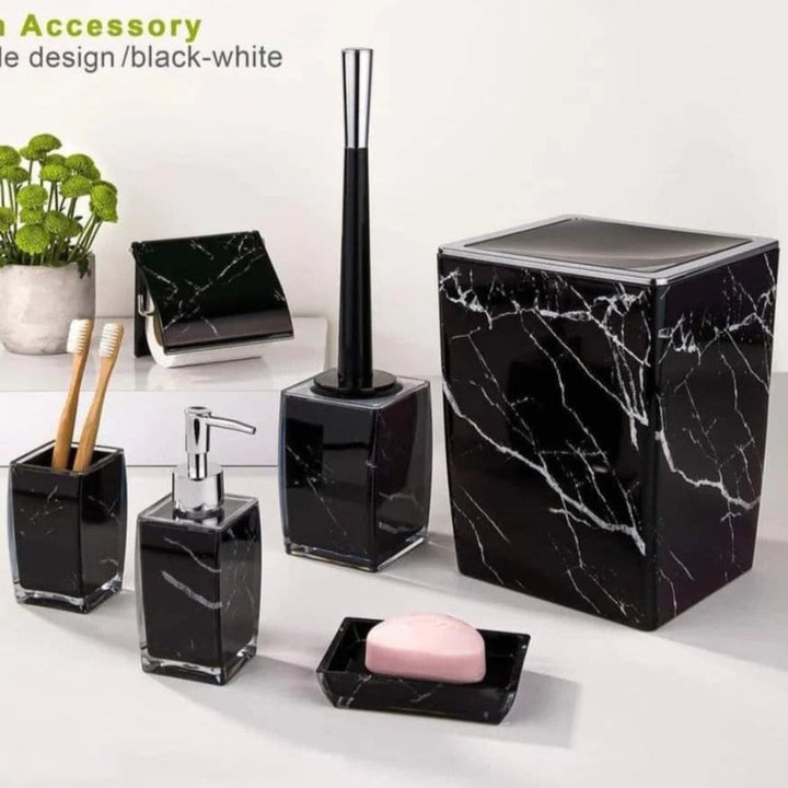 Complete black and white marble bathroom set displayed on a white bathroom countertop, highlighting a luxurious and modern design.