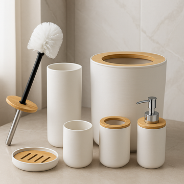 Bathroom accessories set with white containers, wooden accents, and a brush on a neutral background