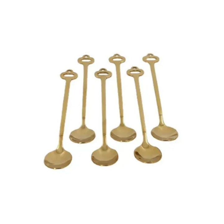 Set of elegant gold dessert and tea spoons displayed on a white background.