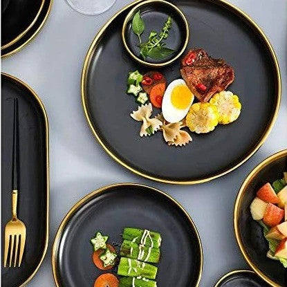  Top view of the large and small plates filled with food, with the tray and sauce bowl slightly visible in the background.