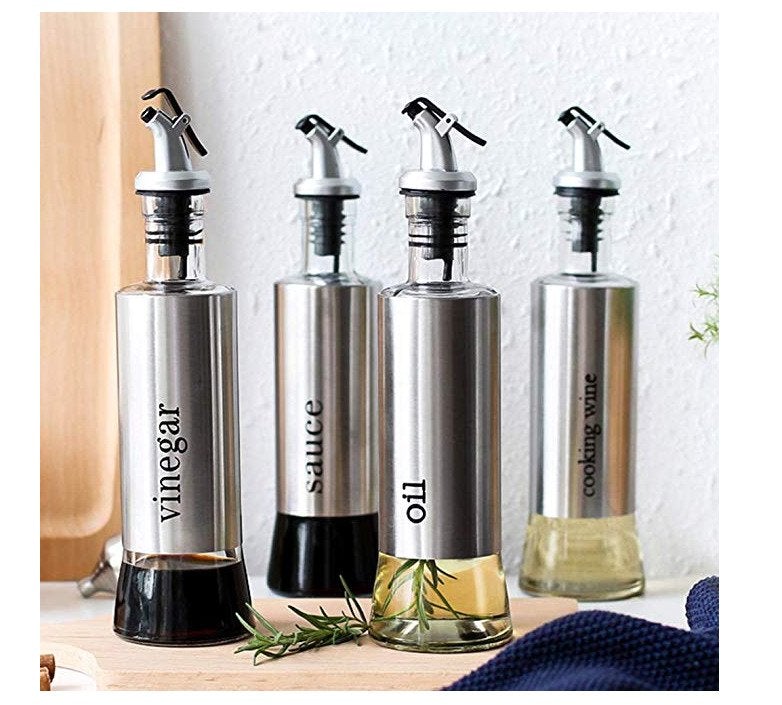 Showcasing 4 oil and vinegar bottles with different liquids (cooking wine, oil, vinegar, sauce), each with a pour spout, placed on a white background.