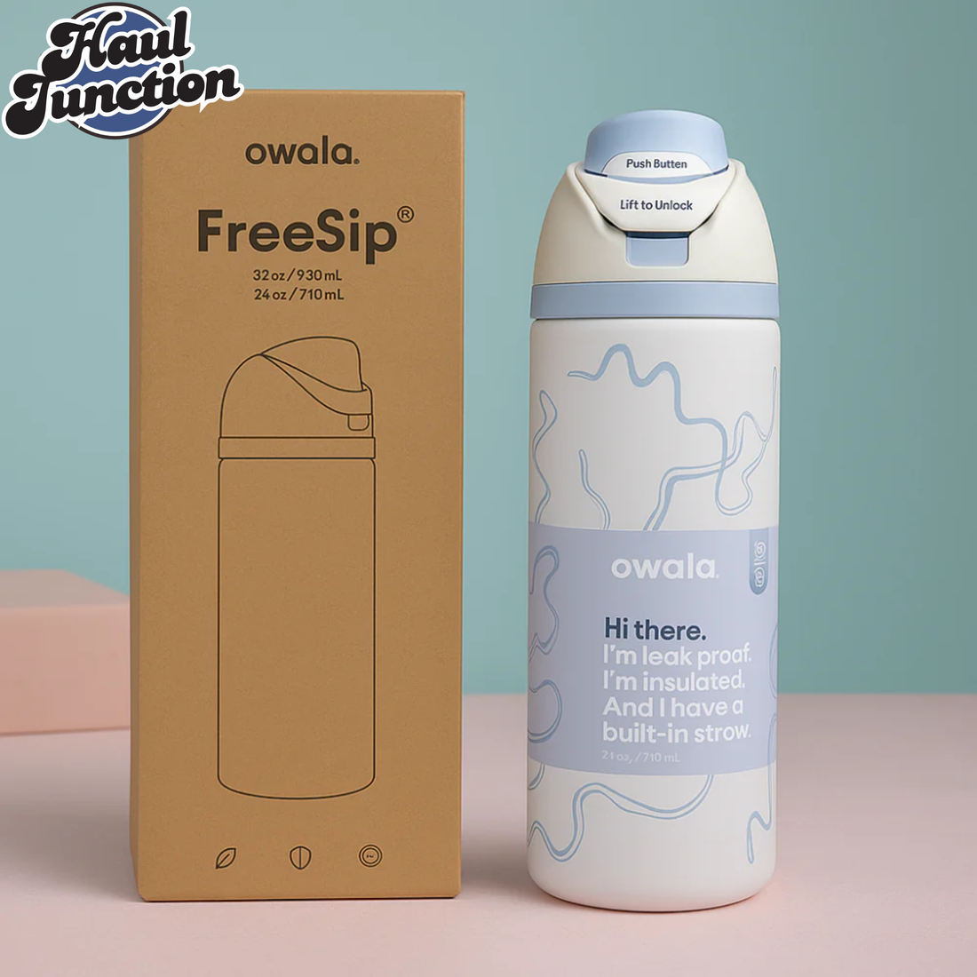 Owala blue ribbon FreeSip water bottle with packaging on a light blue and pink background