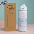 Owala blue ribbon FreeSip water bottle with packaging on a light blue and pink background