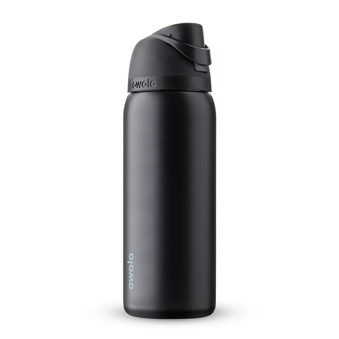 Owala freesip 32oz Black insulated bottle with a black lid on a transparent background