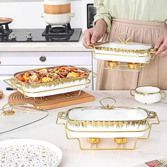 Different angle of the white and gold food warmer set with the small one in hands, all with stands.